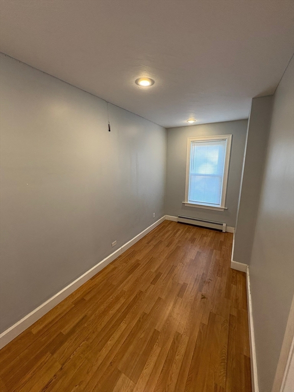 65 School Street Gardner, MA 01440 - Photo 6 of 21 a view of empty room with wooden floor and fan
