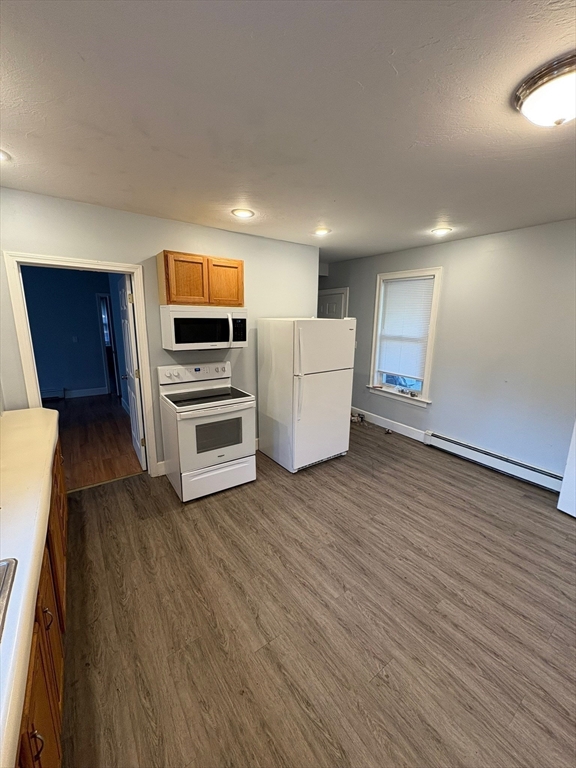 65 School Street Gardner, MA 01440 - Photo 8 of 21 a view of kitchen and wooden floor