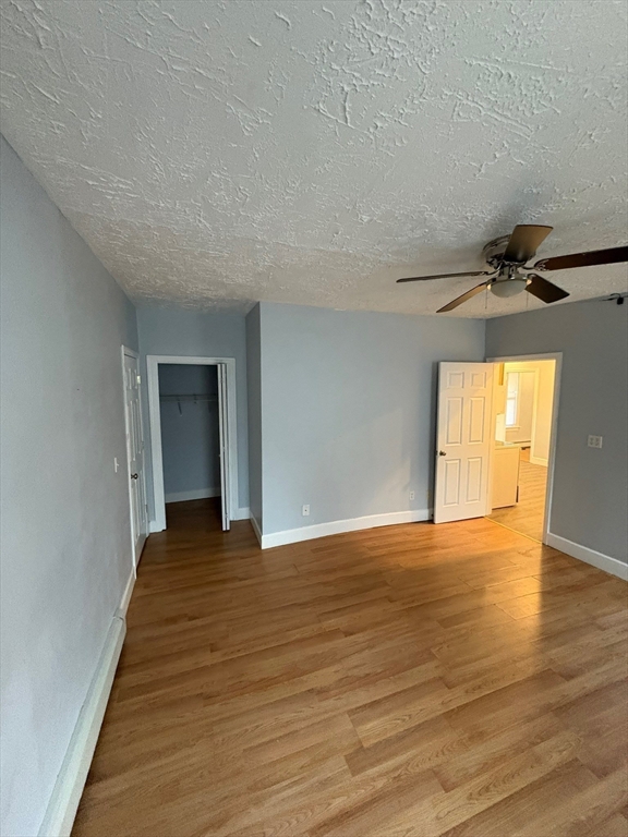 65 School Street Gardner, MA 01440 - Photo 9 of 21 a view of an empty room with wooden floor and a window