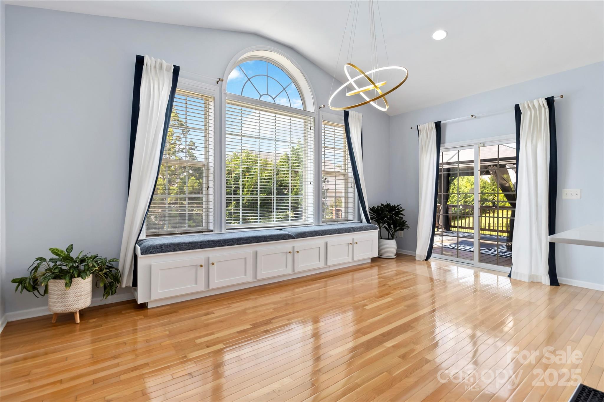 1009 Murandy Lane Matthews, NC 28104 - Photo 21 of 48 a view of empty room with front door and wooden floor