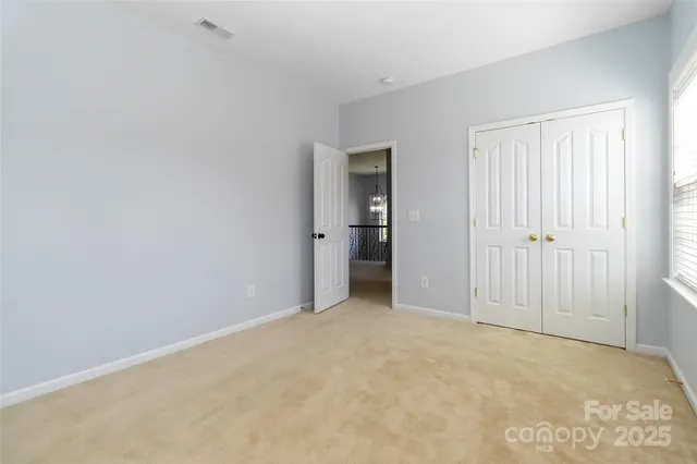 an empty room with closet area