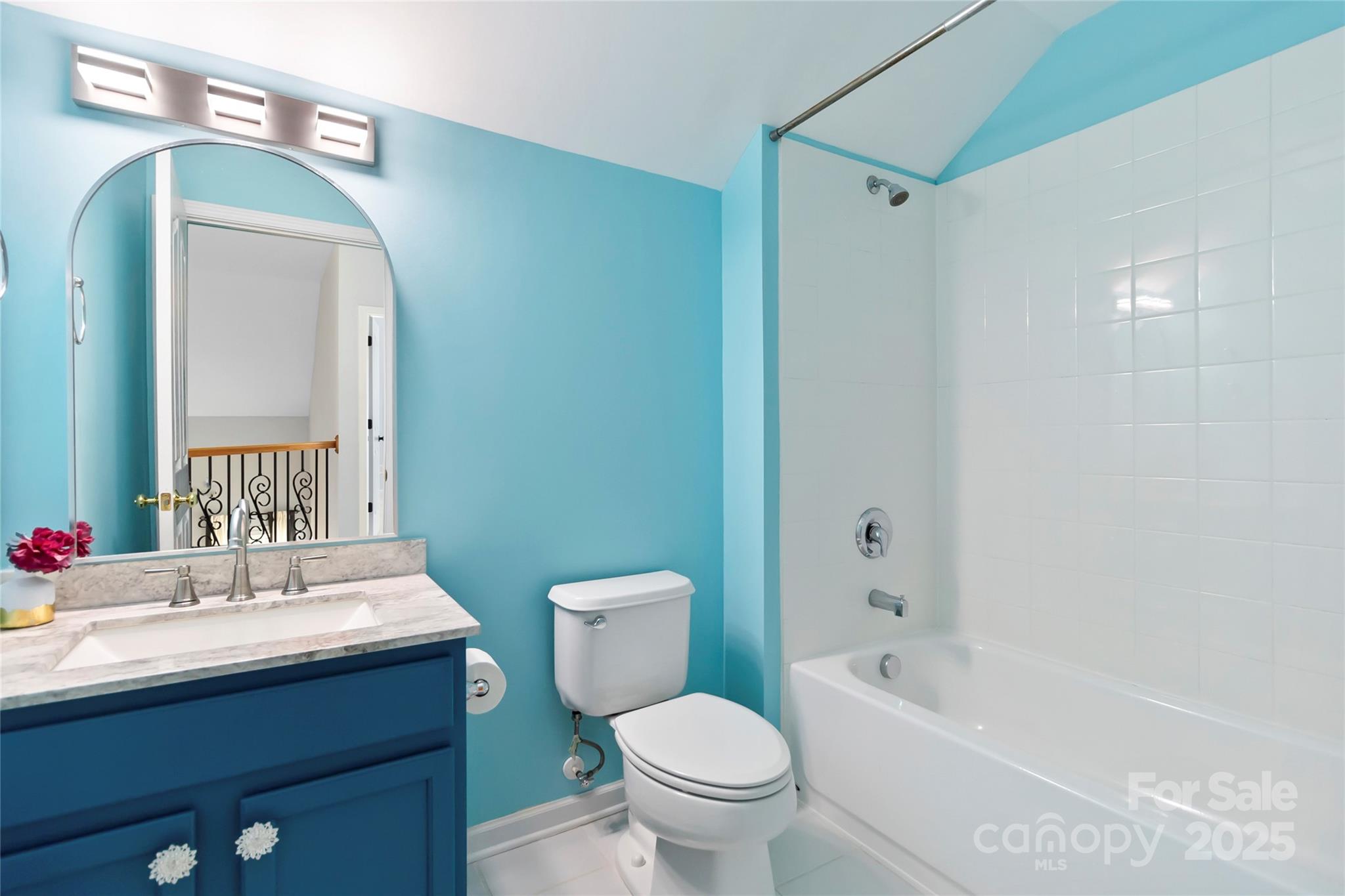 1009 Murandy Lane Matthews, NC 28104 - Photo 31 of 48 a bathroom with a toilet sink and mirror