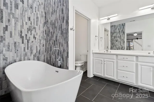 a bathroom with a bathtub and a sink