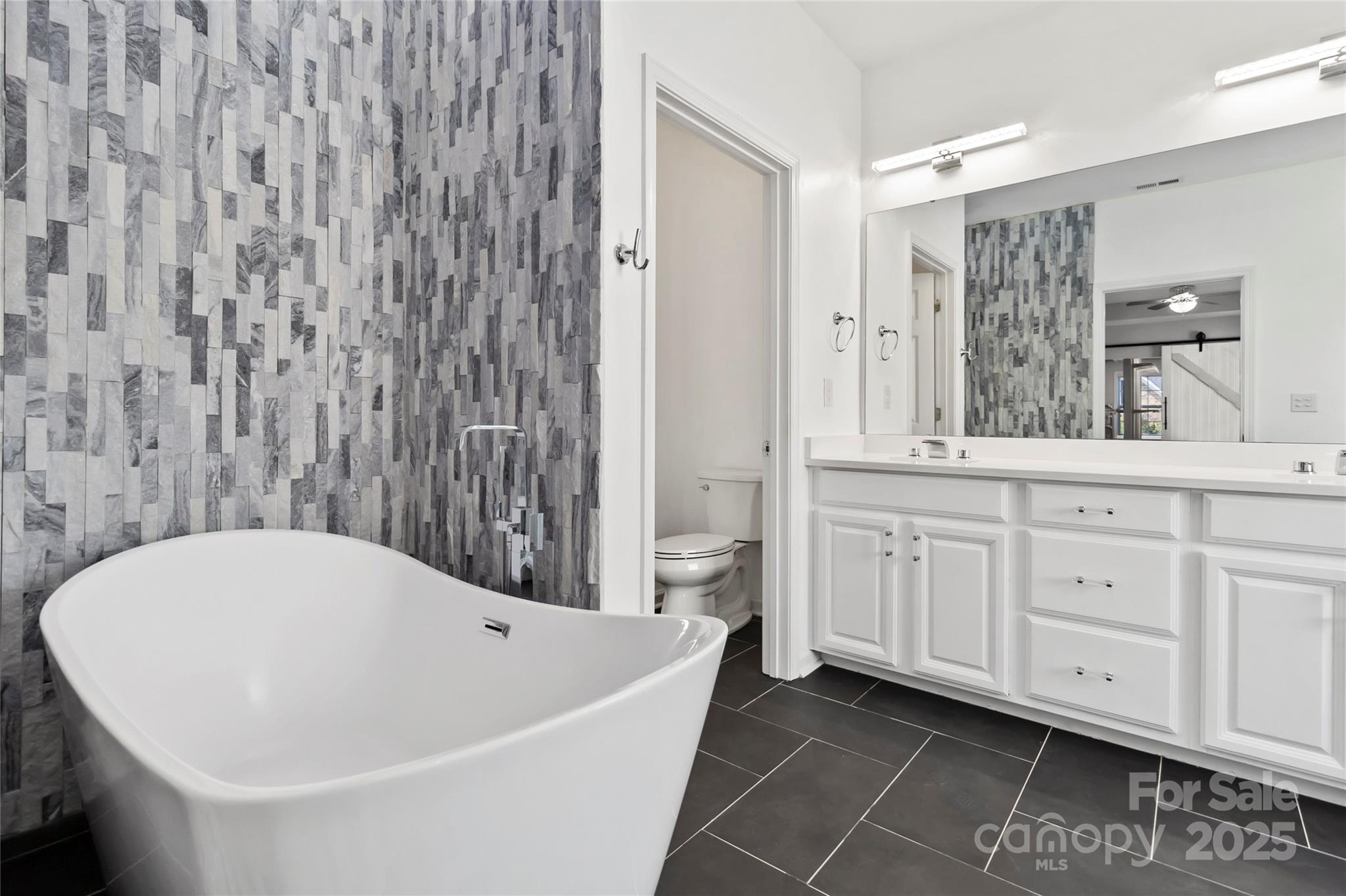 1009 Murandy Lane Matthews, NC 28104 - Photo 37 of 48 a bathroom with a bathtub and a sink