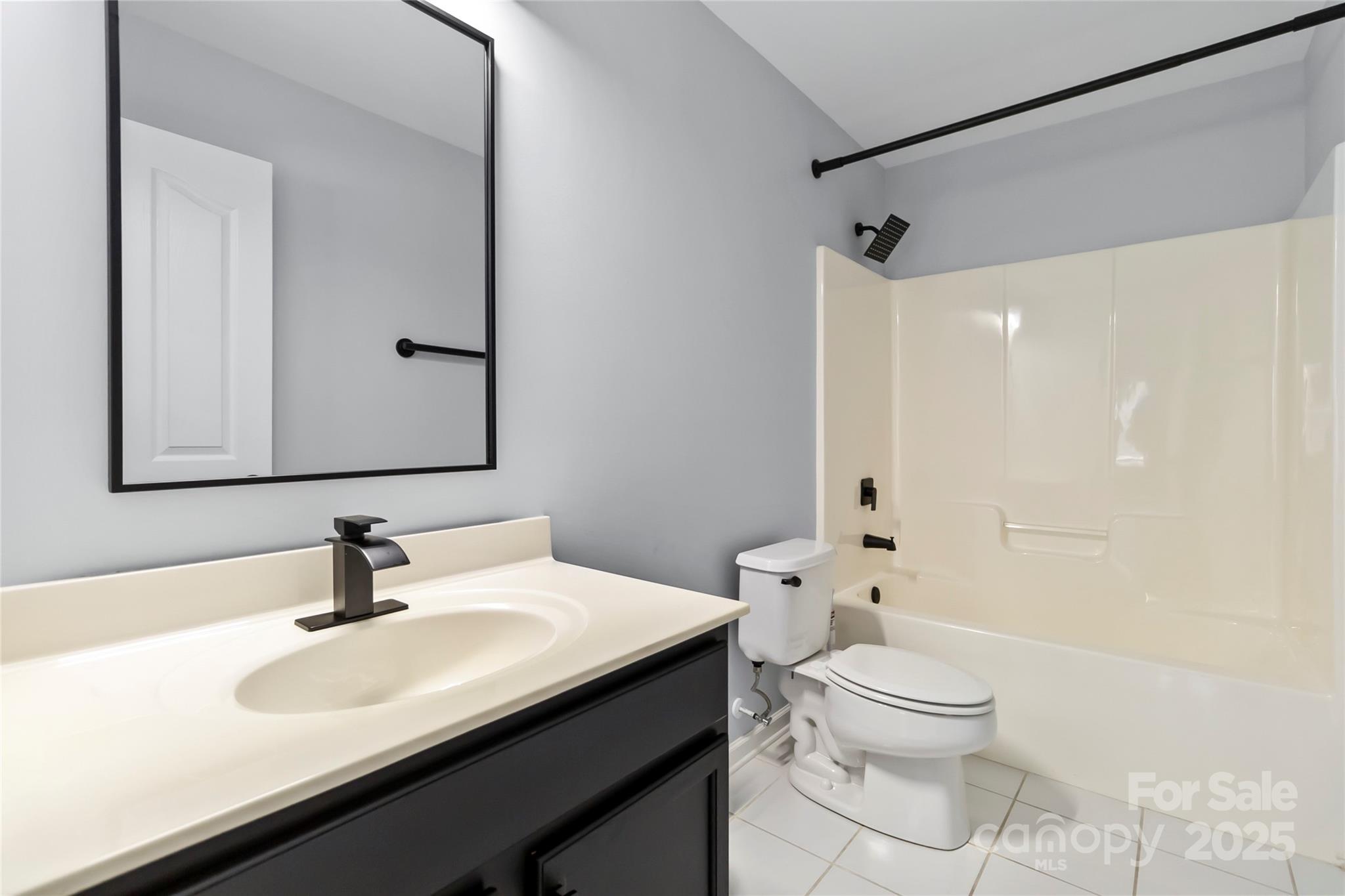 1009 Murandy Lane Matthews, NC 28104 - Photo 38 of 48 a bathroom with a sink a toilet and shower