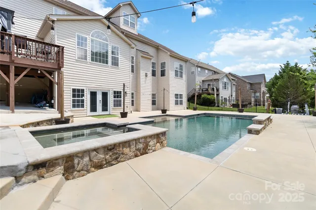 a view of a house with swimming pool