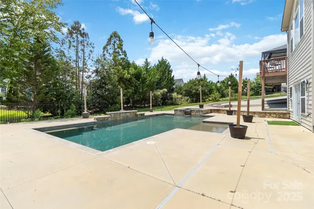 a view of a swimming pool with a patio