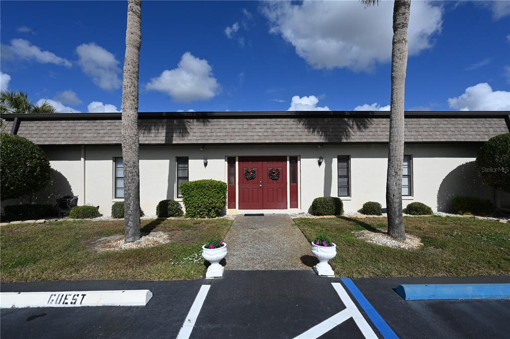 1731 Bonitas Circle, Unit 1720C Venice, FL 34293 - Photo 20 of 21 a front view of a house with garden