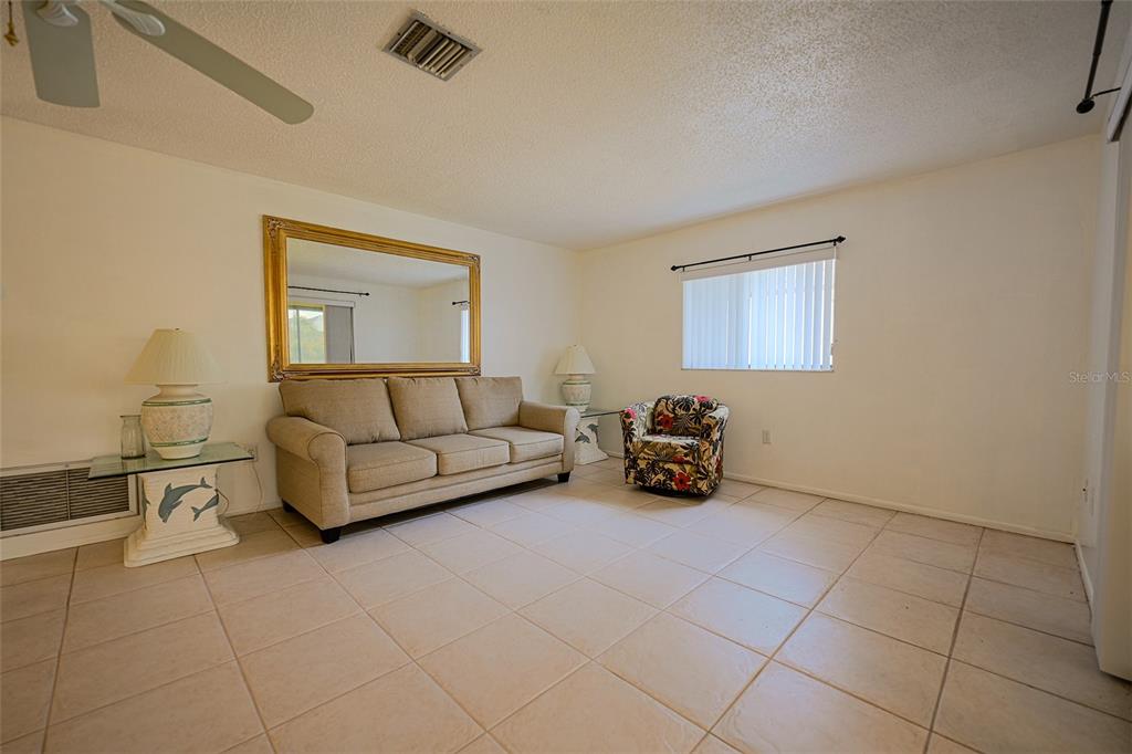 1731 Bonitas Circle, Unit 1720C Venice, FL 34293 - Photo 6 of 21 a view of livingroom with furniture and window