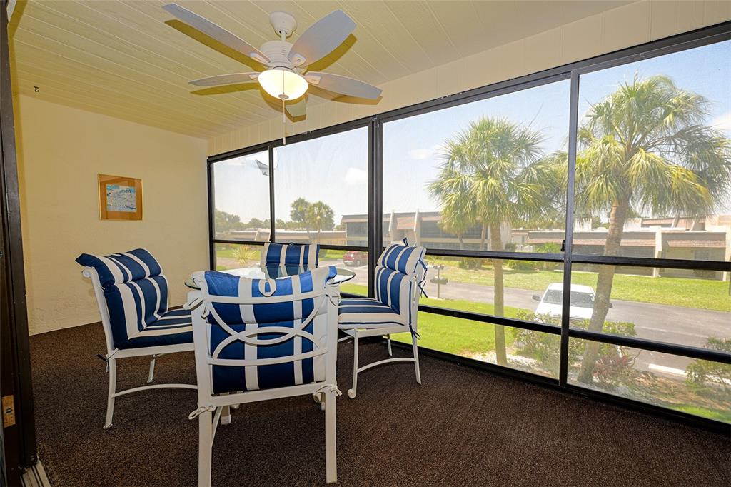 1731 Bonitas Circle, Unit 1720C Venice, FL 34293 - Photo 7 of 21 a view of a city from a dining room with large windows