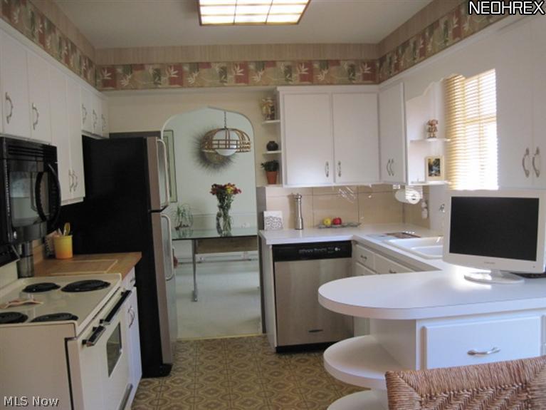 487 Sand Run Road Akron, OH 44313 - Photo 8 of 21 Another view of the kitchen that looks into the dining room.