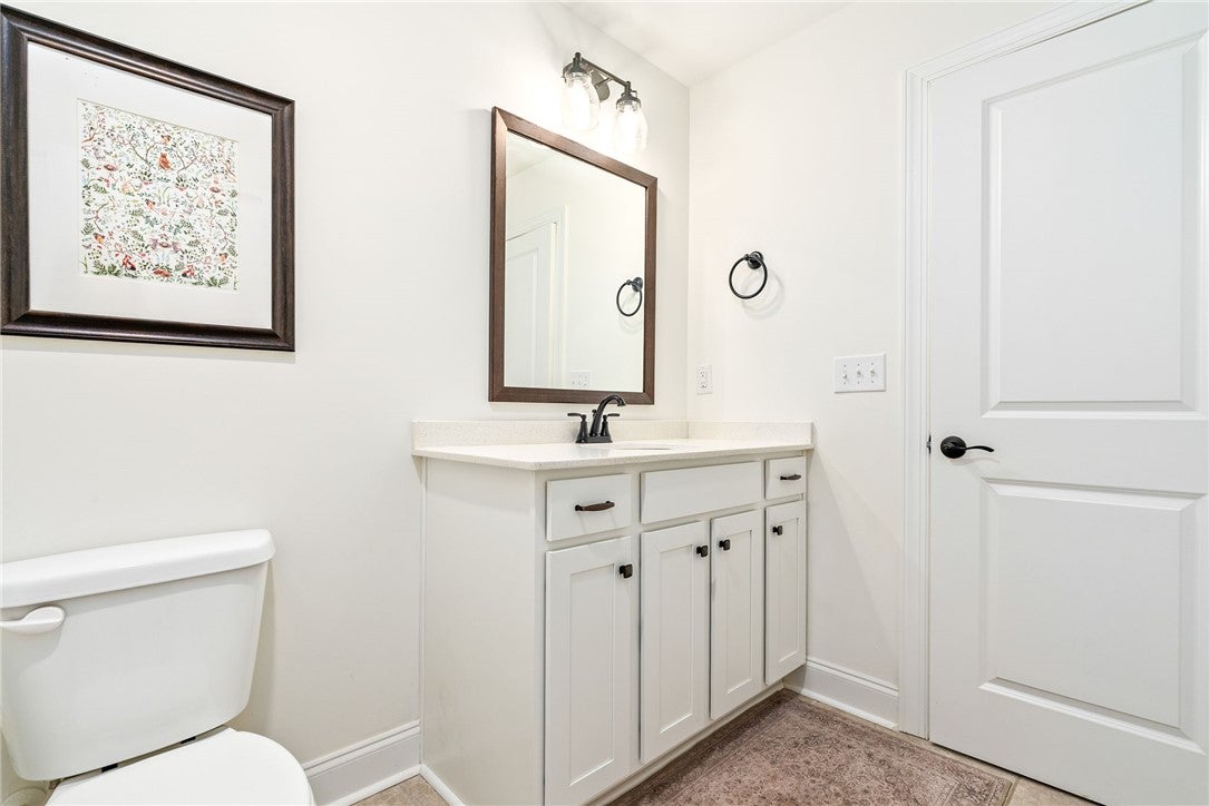 2324 Rutland Road Auburn, AL 36832 - Photo 15 of 22 This bright bathroom features a spacious vanity with elegant hardware and ample storage.