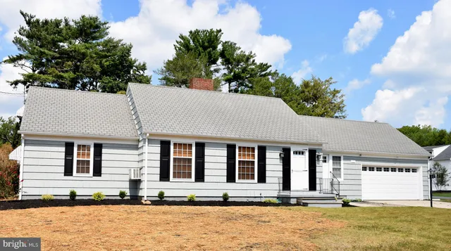 a front view of a house with large windows