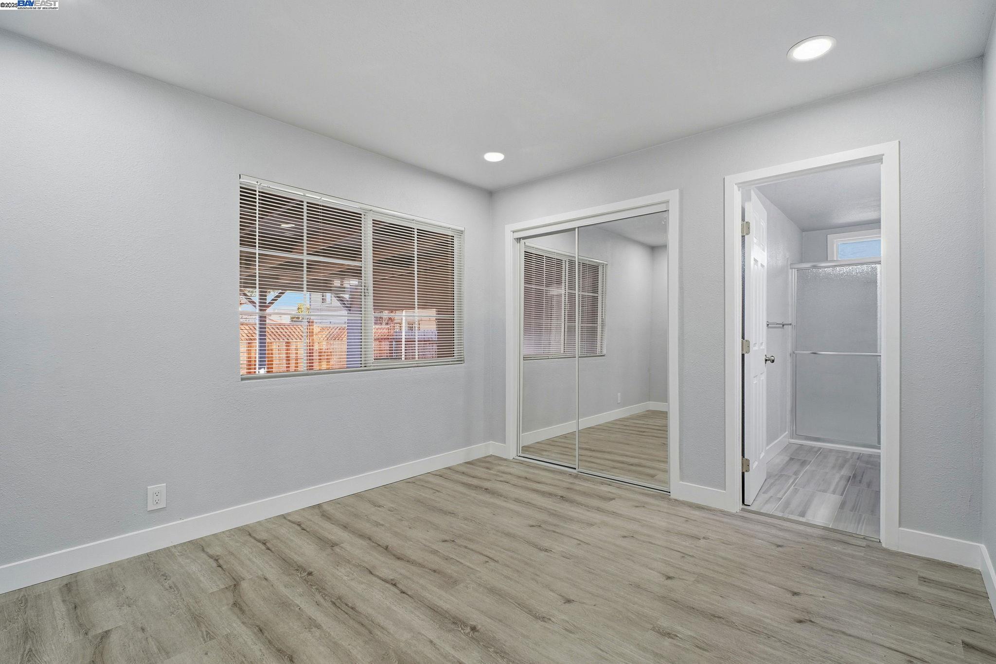 38016 Vallejo Street Fremont, CA 94536 - Photo 16 of 32 wooden floor in an empty room with a window