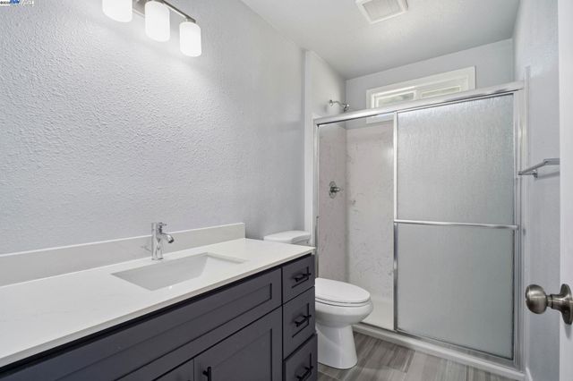 a bathroom with a shower and mirror