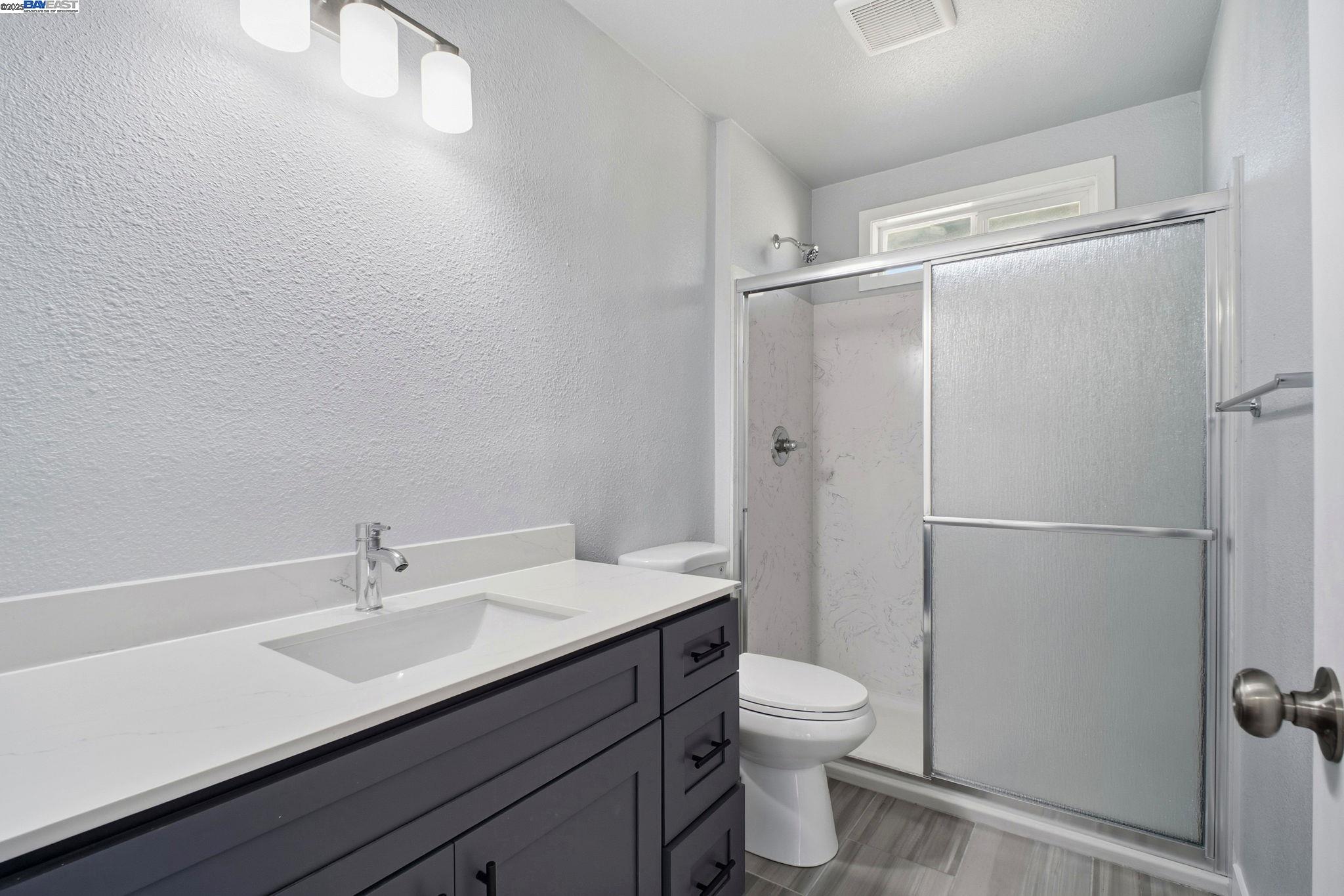 38016 Vallejo Street Fremont, CA 94536 - Photo 20 of 32 a bathroom with a sink toilet and shower