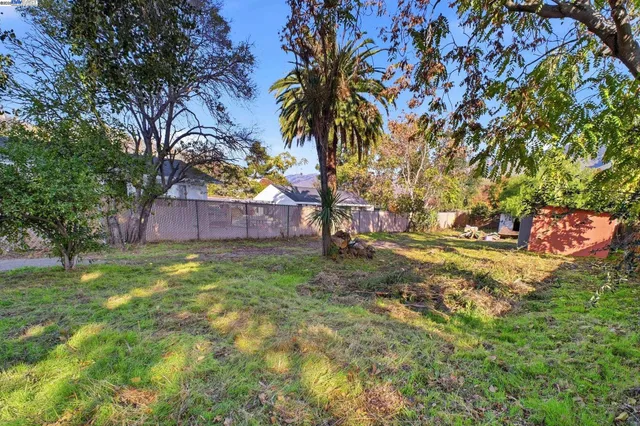 a front view of a house with a yard and table and chairs
