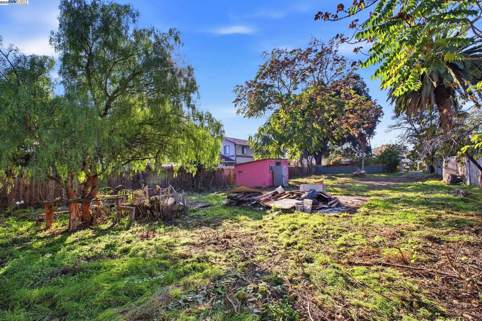 38016 Vallejo Street Fremont, CA 94536 - Photo 29 of 32 a backyard of a house with table and chairs