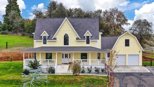 a view of a house with a yard porch and sitting area