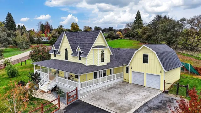 a view of a hallway to a livingroom with furniture