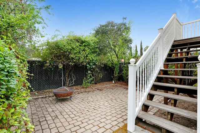 a view of a backyard with sitting area