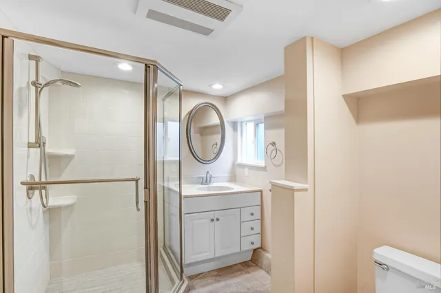 a bathroom with a mirror a sink and a mirror