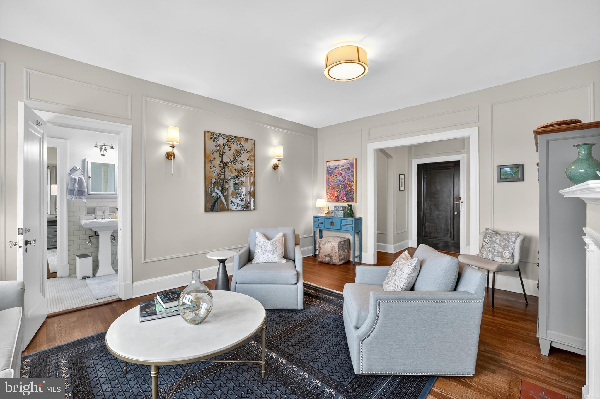 1661 Crescent Place Northwest, Unit 604 Washington, DC 20009 - Photo 11 of 61 a living room with furniture and a wooden floor