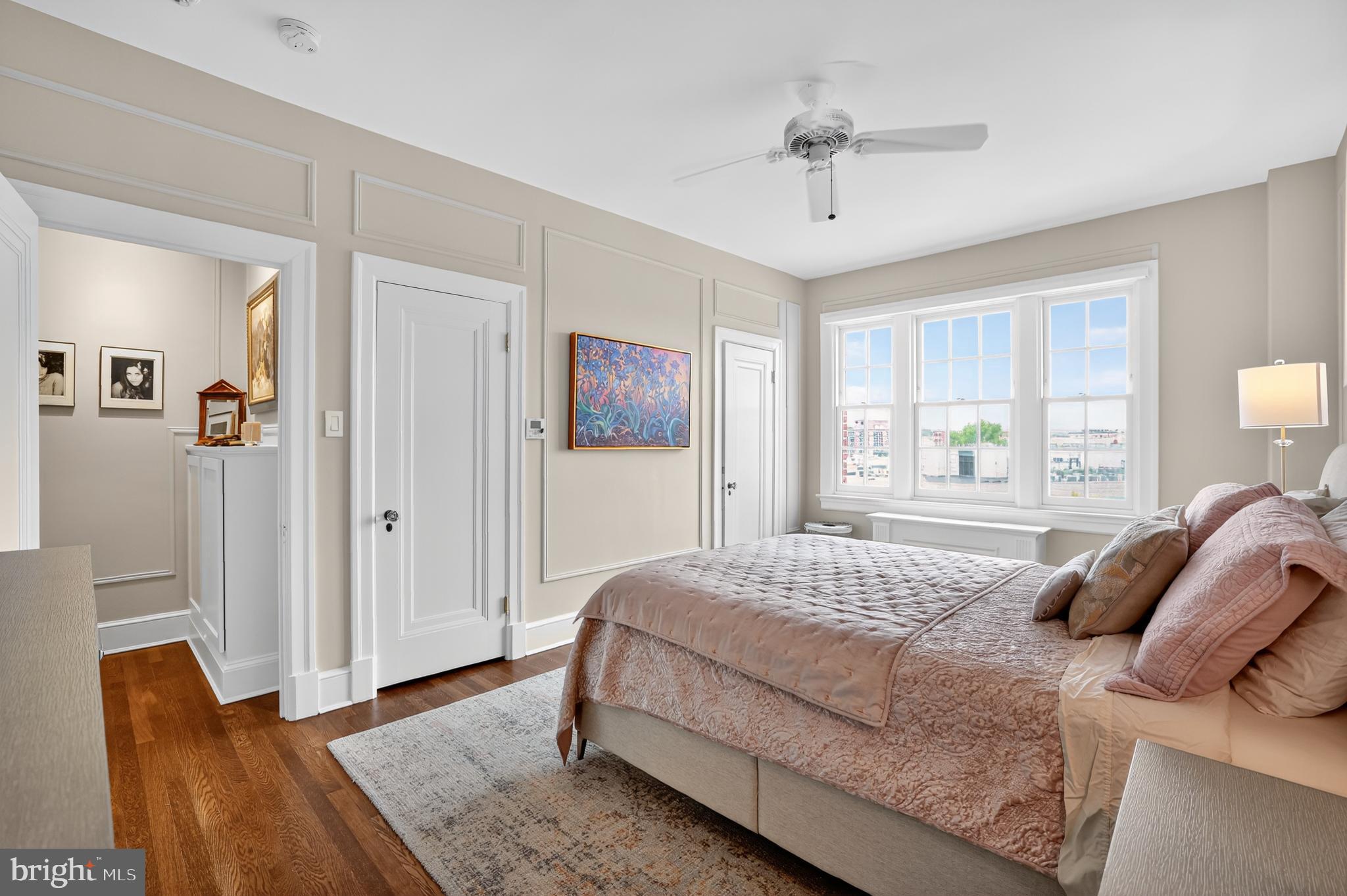 1661 Crescent Place Northwest, Unit 604 Washington, DC 20009 - Photo 16 of 61 a bedroom with a bed and a chandelier