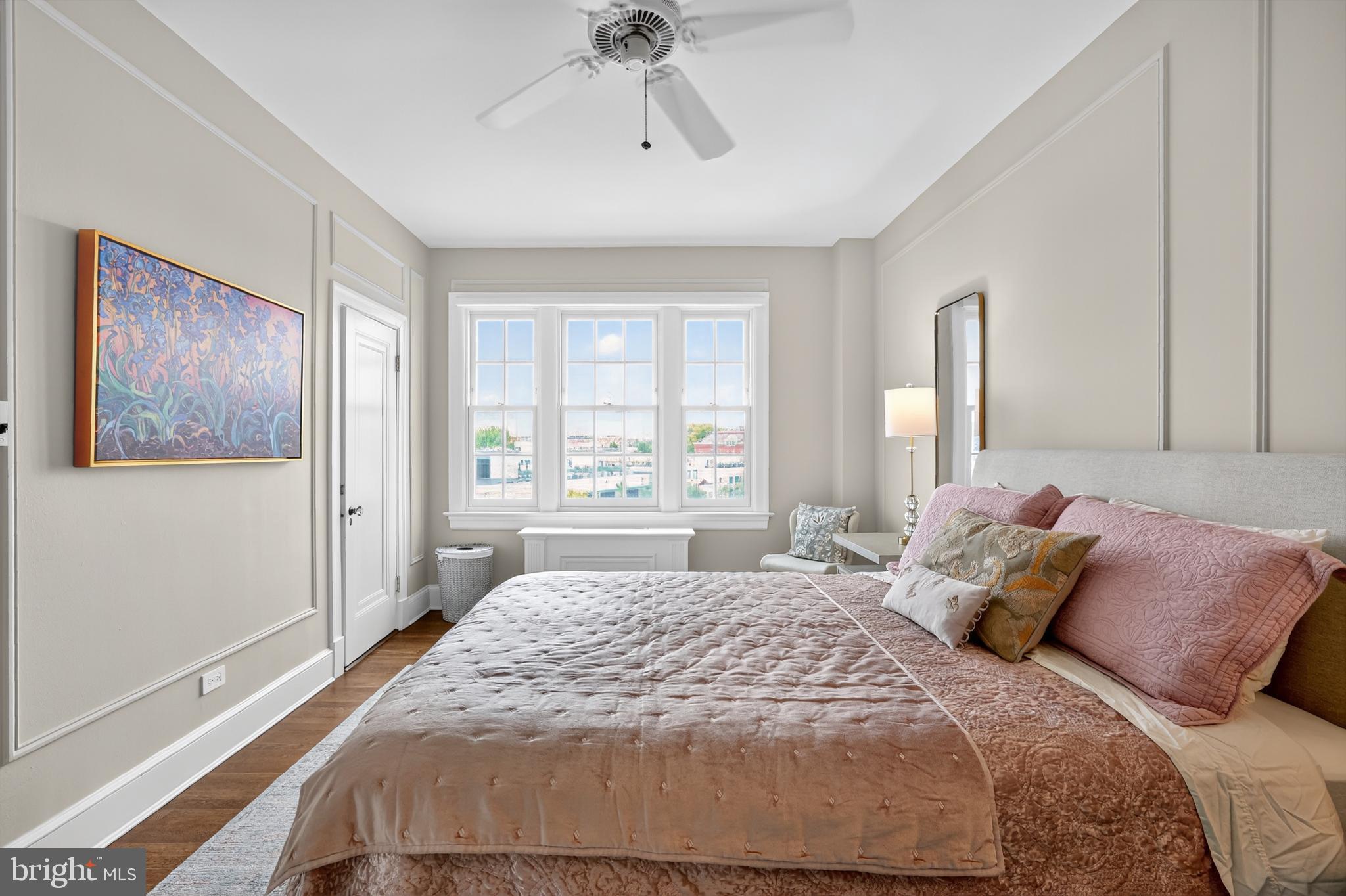 1661 Crescent Place Northwest, Unit 604 Washington, DC 20009 - Photo 17 of 61 a bedroom with a large bed and a window