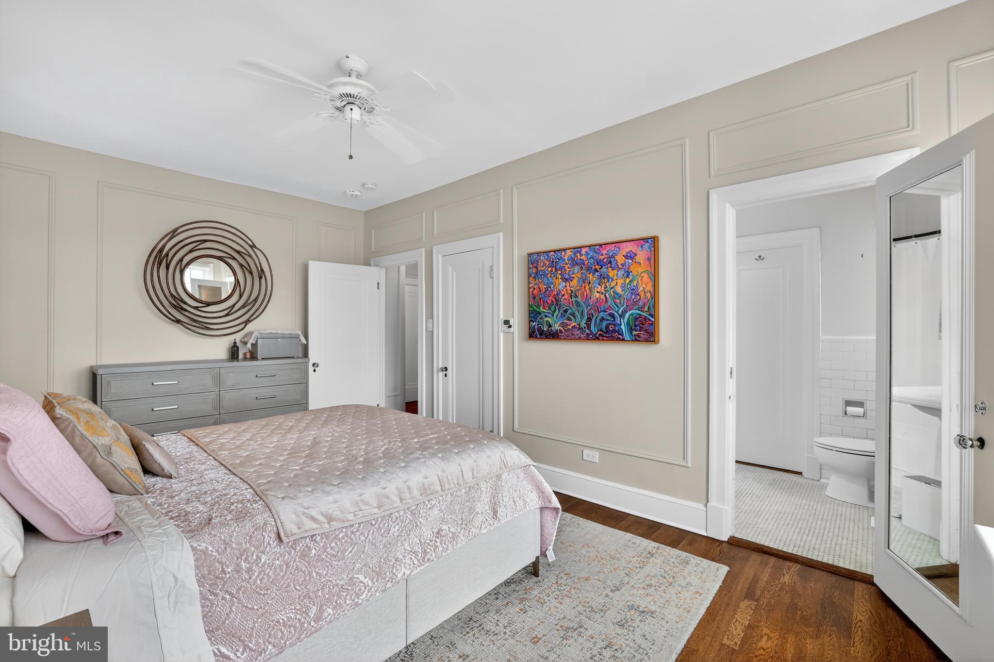 1661 Crescent Place Northwest, Unit 604 Washington, DC 20009 - Photo 21 of 61 a bedroom with a bed and a chandelier