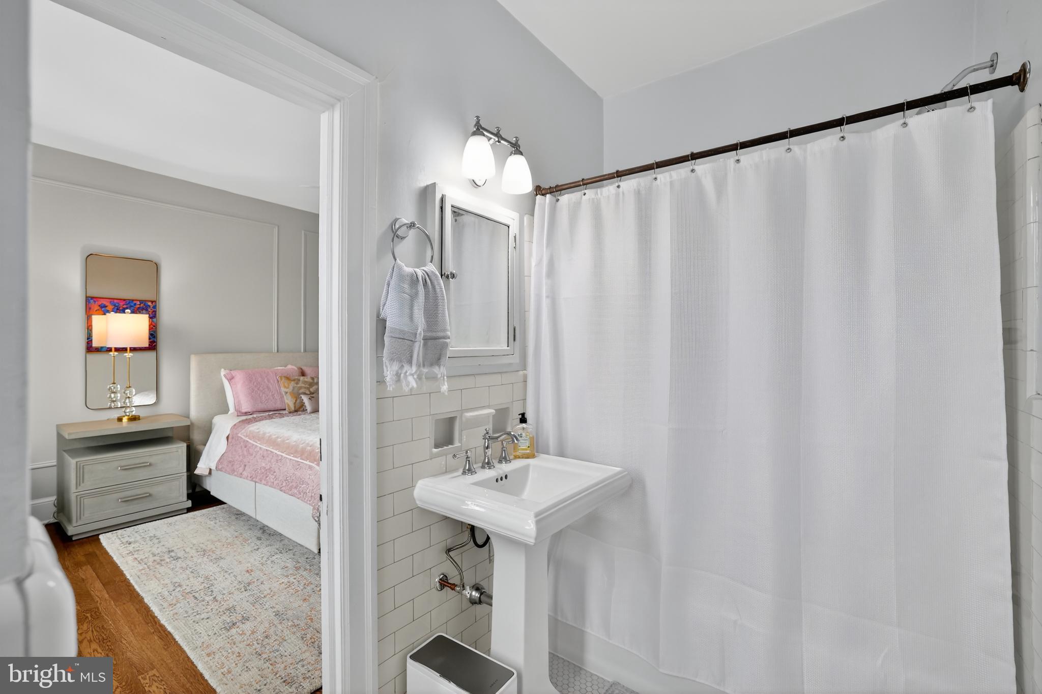 1661 Crescent Place Northwest, Unit 604 Washington, DC 20009 - Photo 22 of 61 a bathroom with a sink and a mirror