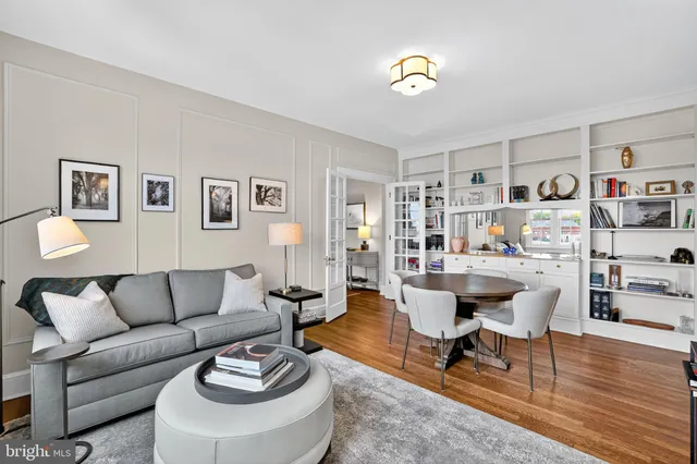 a dining room with furniture and wooden floor