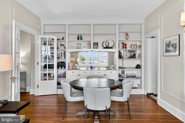 a kitchen with kitchen island a counter space a sink a window and stainless steel appliances