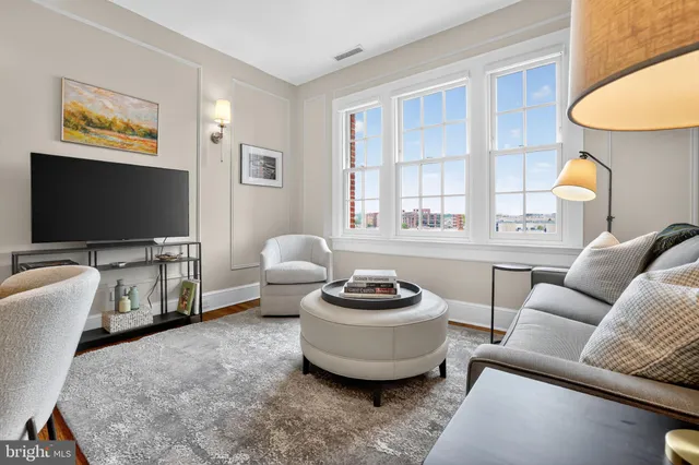 a kitchen with a sink a counter and cabinets