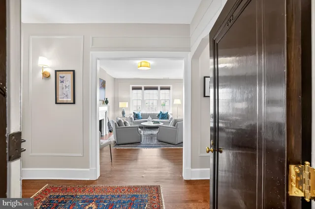a living room with furniture and a glass door