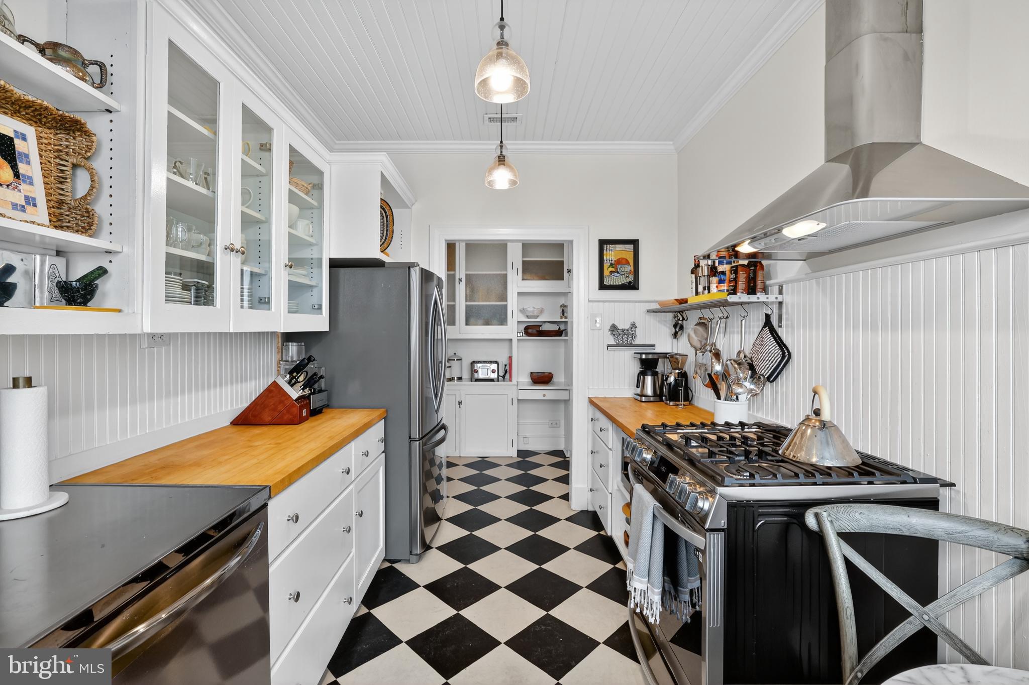 1661 Crescent Place Northwest, Unit 604 Washington, DC 20009 - Photo 34 of 61 a kitchen with stainless steel appliances granite countertop a stove and a refrigerator