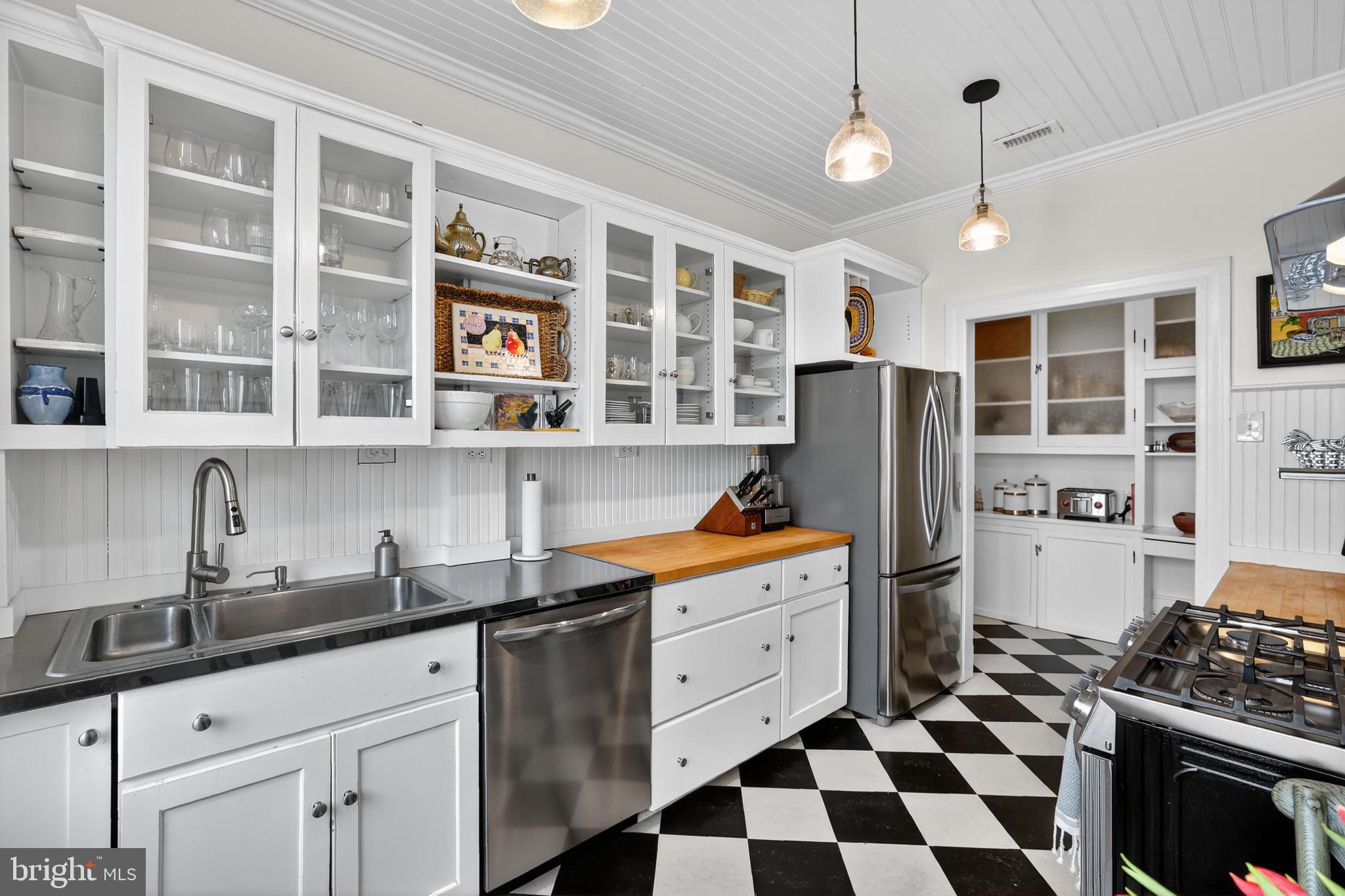 1661 Crescent Place Northwest, Unit 604 Washington, DC 20009 - Photo 35 of 61 a kitchen with stainless steel appliances granite countertop a sink stove and refrigerator