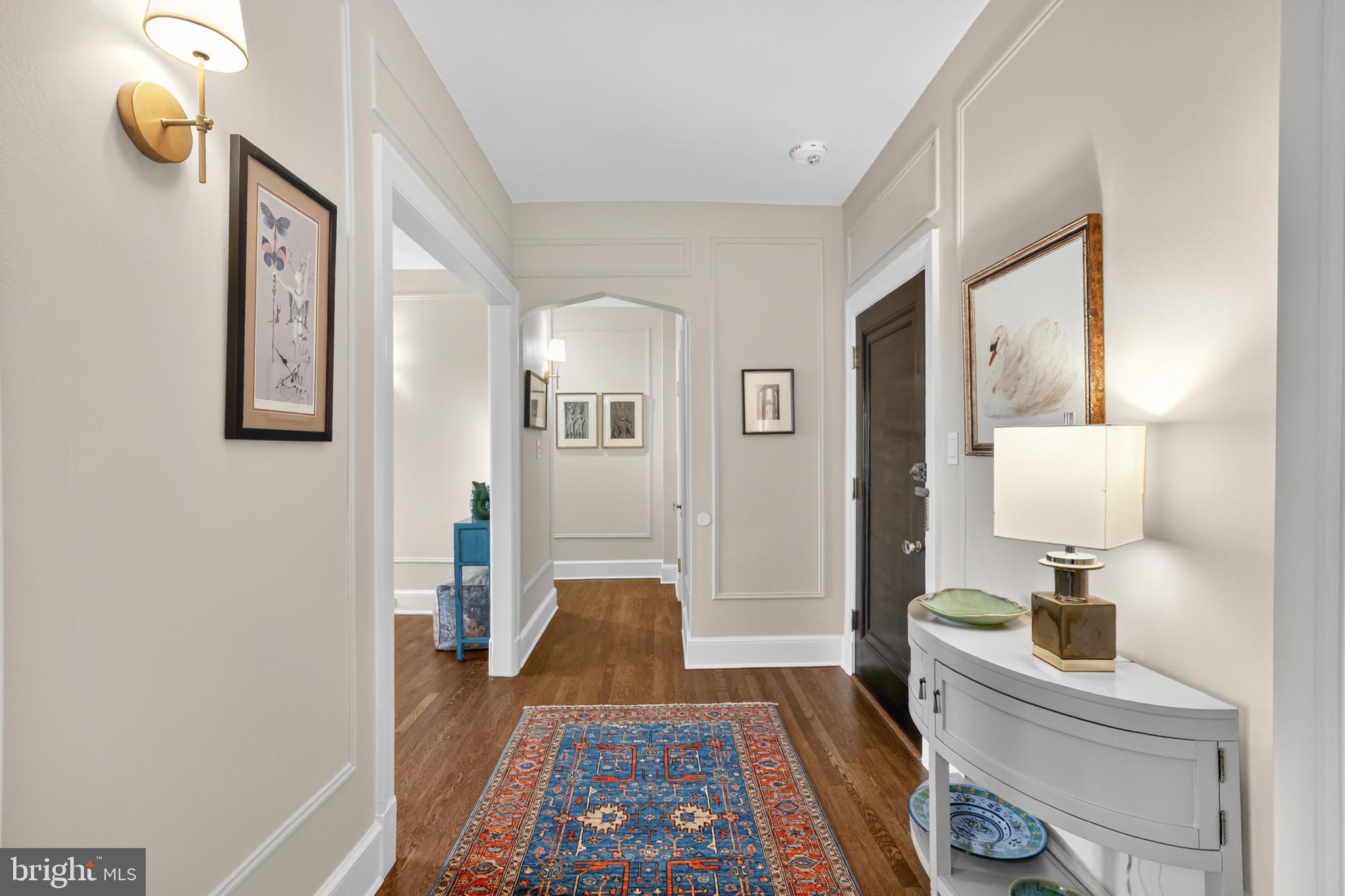 1661 Crescent Place Northwest, Unit 604 Washington, DC 20009 - Photo 5 of 61 a bed room with a bed and a lamp