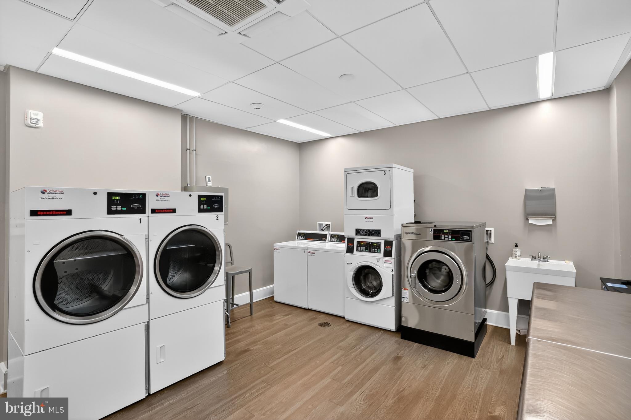 1661 Crescent Place Northwest, Unit 604 Washington, DC 20009 - Photo 51 of 61 a utility room with dryer and washer