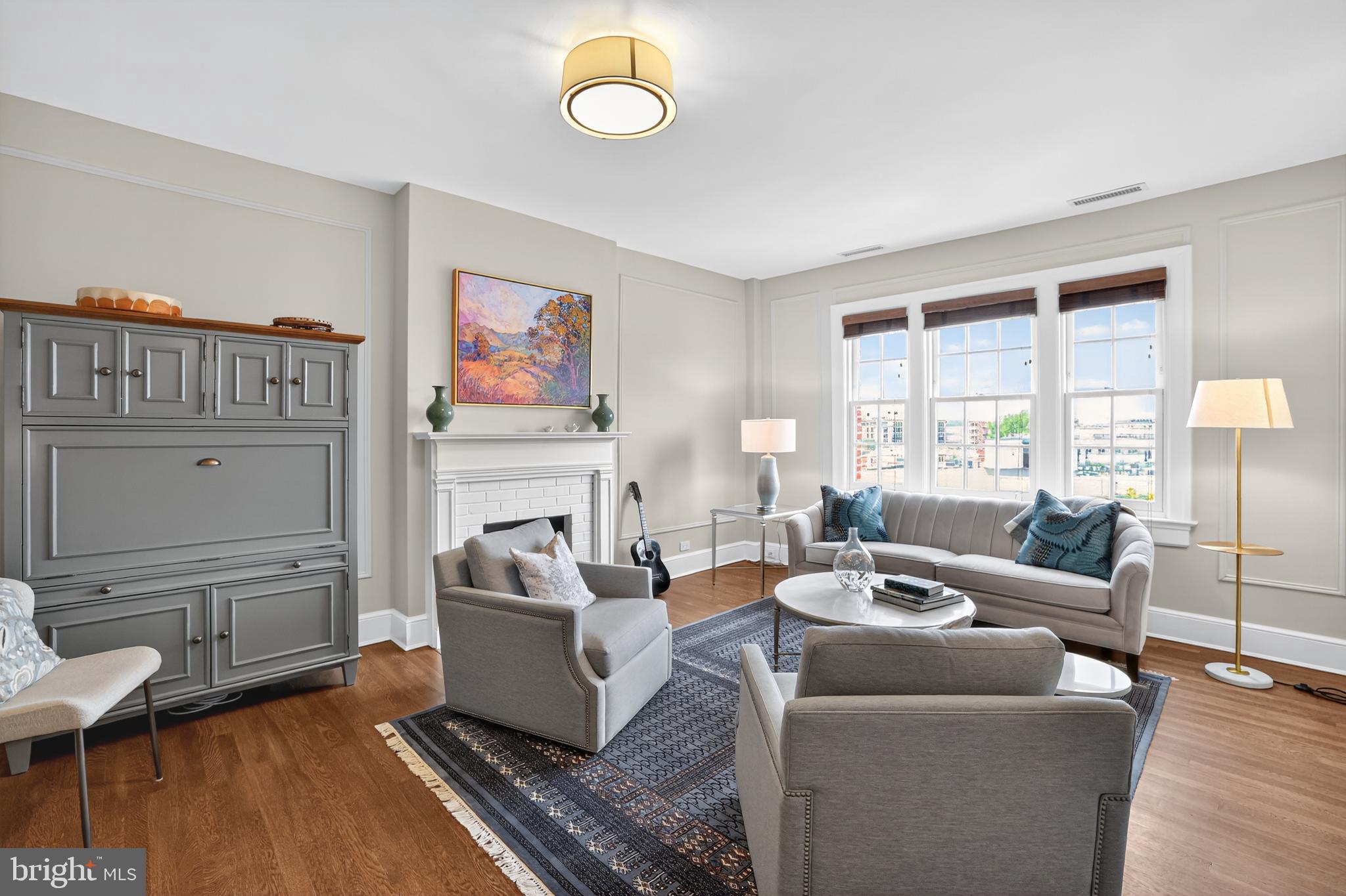 1661 Crescent Place Northwest, Unit 604 Washington, DC 20009 - Photo 7 of 61 a living room with furniture and a flat screen tv