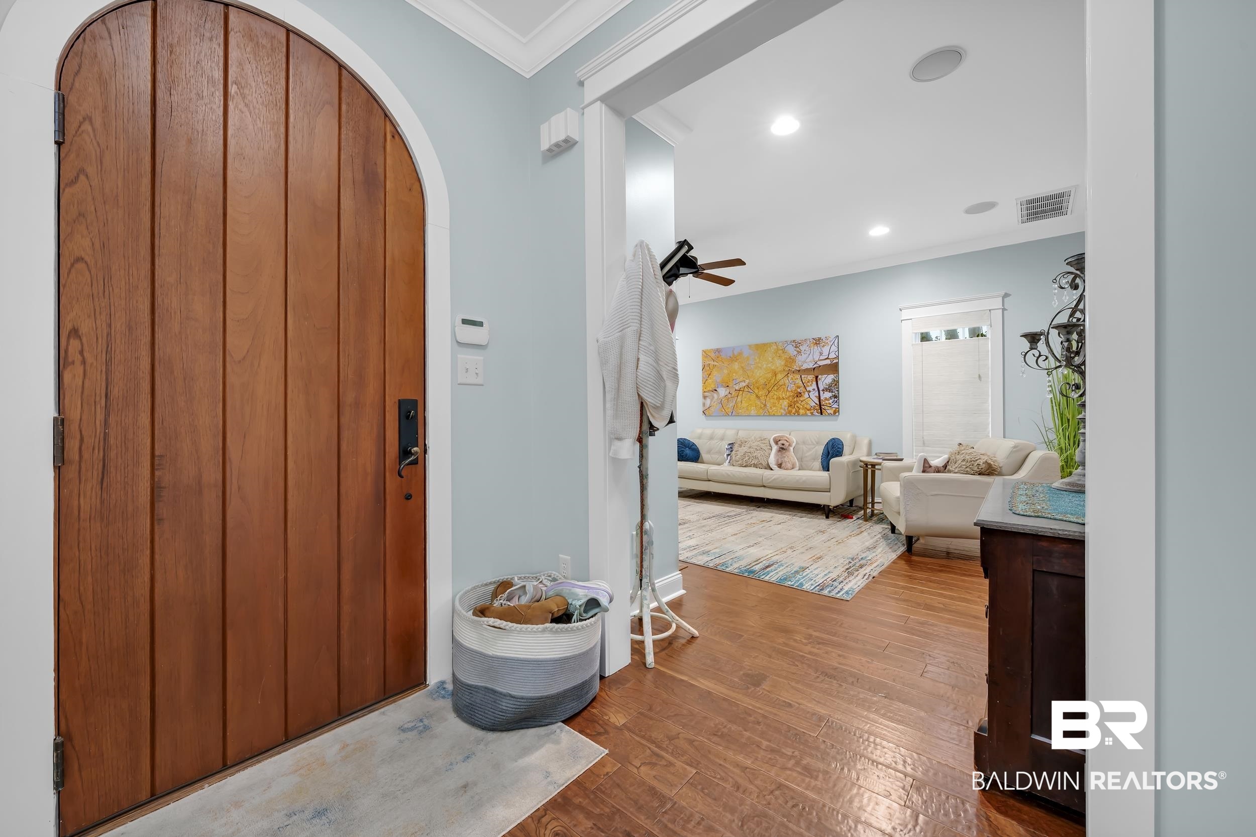 7 Bienville Avenue Mobile, AL 36606 - Photo 5 of 32 Foyer entrance featuring arched walkways, crown molding, dark wood-type flooring, a ceiling fan, and recessed lighting