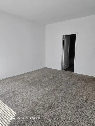 a view of an empty room and closet