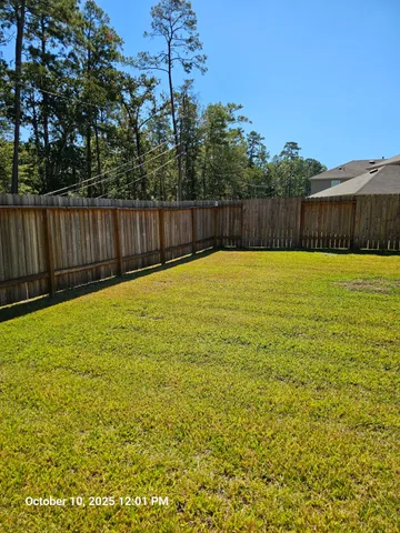 a swimming pool with wooden fence