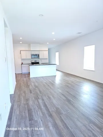 a view of kitchen and wooden floor