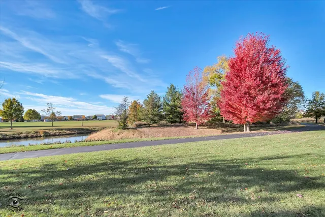 a view of a lake with a big yard