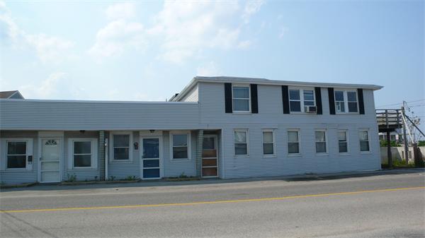 153 Jericho Road Scituate, MA 02066 - Photo 1 of 5 a front view of a building with a lots of windows