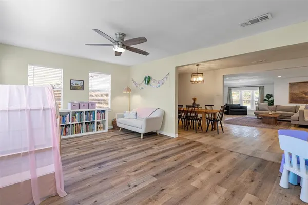 a living room with furniture and a table