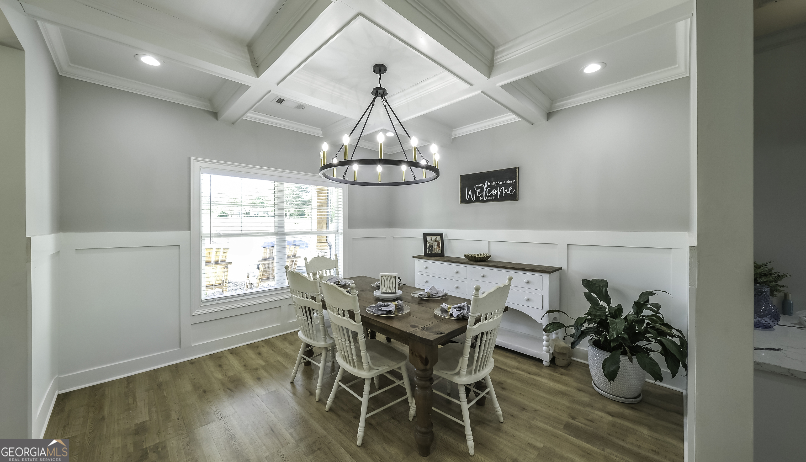 2392 Welcome Road Roopville, GA 30170 - Photo 6 of 43 a view of a dining room with furniture wooden floor and chandelier