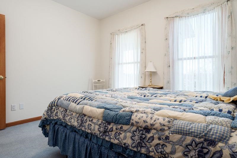 19905 State Line Road Harvard, IL 60033 - Photo 25 of 55 a bedroom with a bed and a window