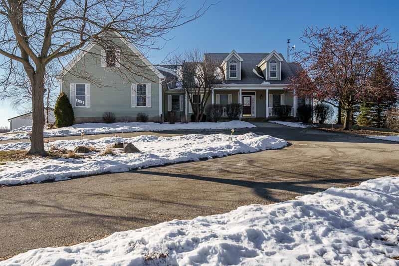 19905 State Line Road Harvard, IL 60033 - Photo 4 of 55 a front view of a house with a yard